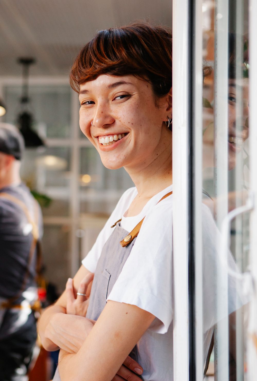Barista preparing coffee behind the counter