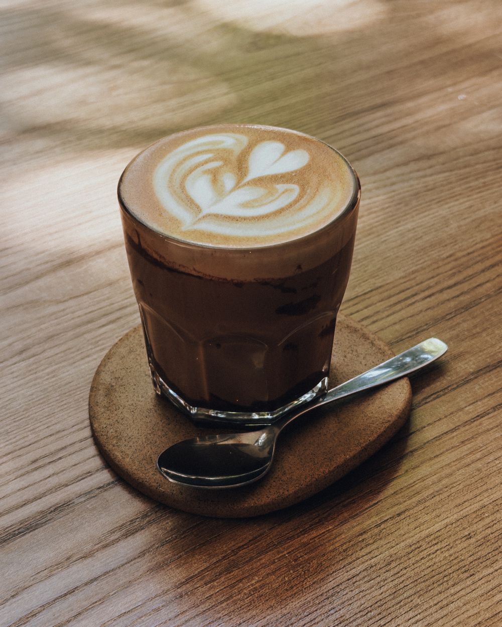 Latte art in a glass cup